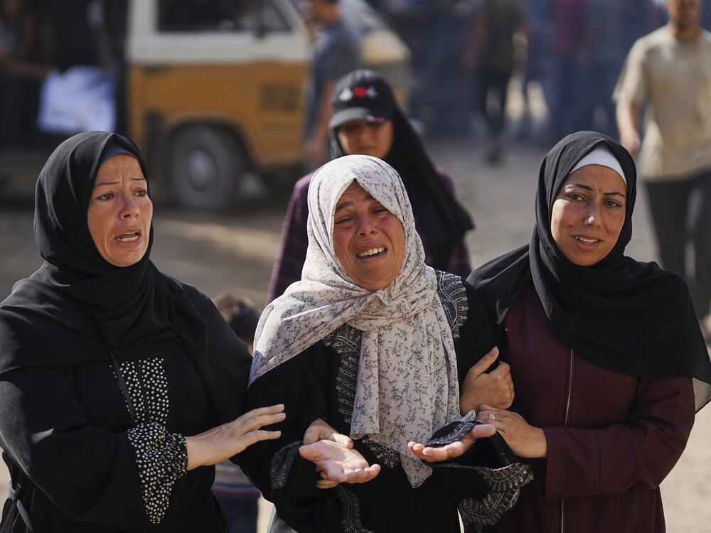 Relatives of Palestinians killed in Israeli strikes on the Gaza Strip mourn their deaths at Al-Shifa Hospital in Gaza City, Saturday.