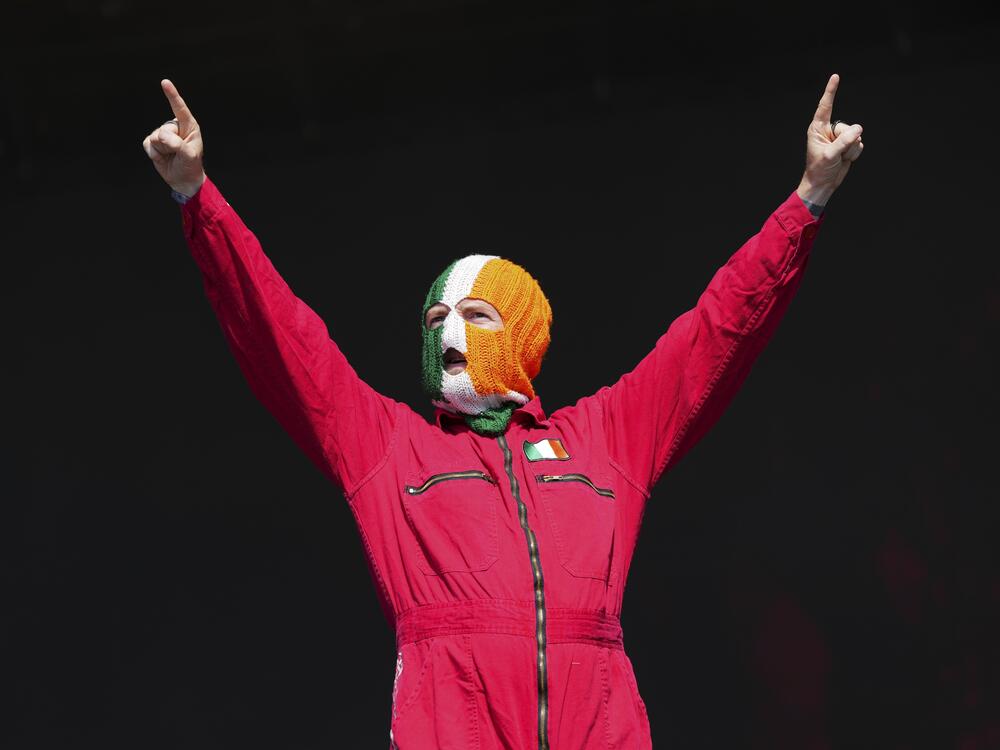 J. J. O Dochartaigh from the hip hop trio Kneecap performs during the Glastonbury Festival in Worthy Farm, Somerset, England, Saturday, June 28, 2025.
