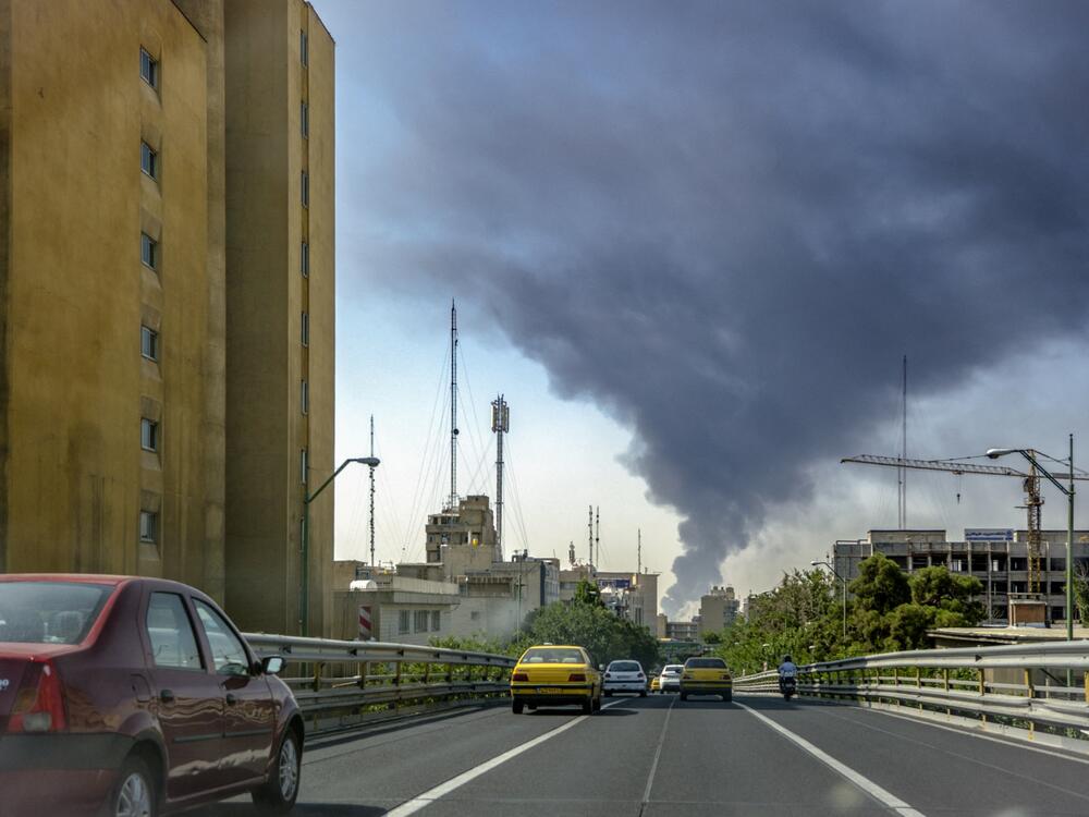 Smoke rises from locations targeted in Tehran amid the third day of Israel's waves of strikes against Iran, on June 15. While this image is real, the proliferation of AI-generated images has allowed state-backed influence campaigns to flourish.