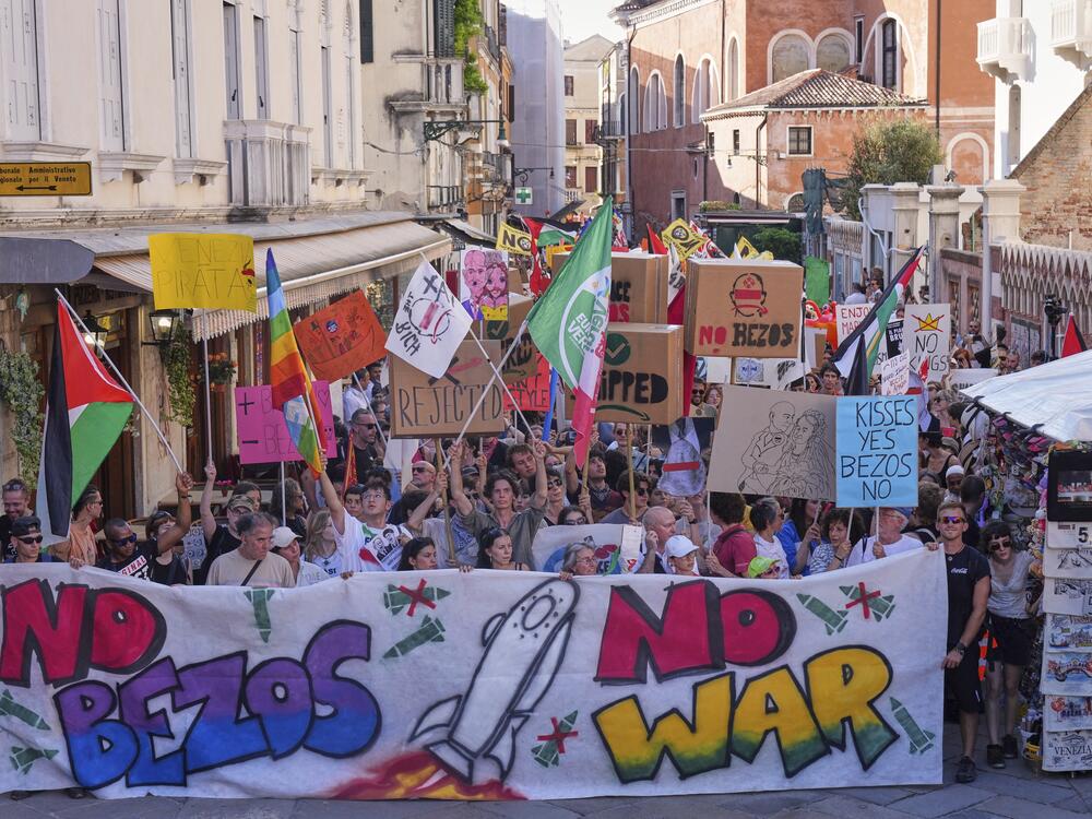 Activists stage a protest in Venice, Italy, Saturday, June 28, 2025, denouncing the three-day celebrations for the wedding between Jeff Bezos and his wife Lauren Sanchez Bezos that took place in Venice.