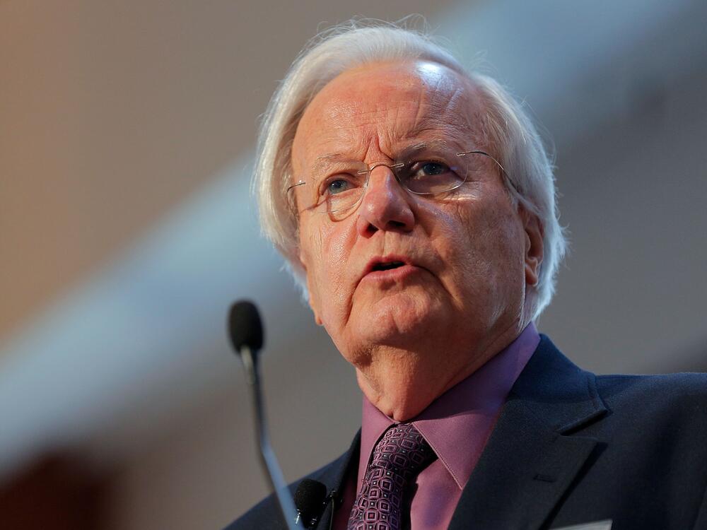 Journalist Bill Moyers moderates the 