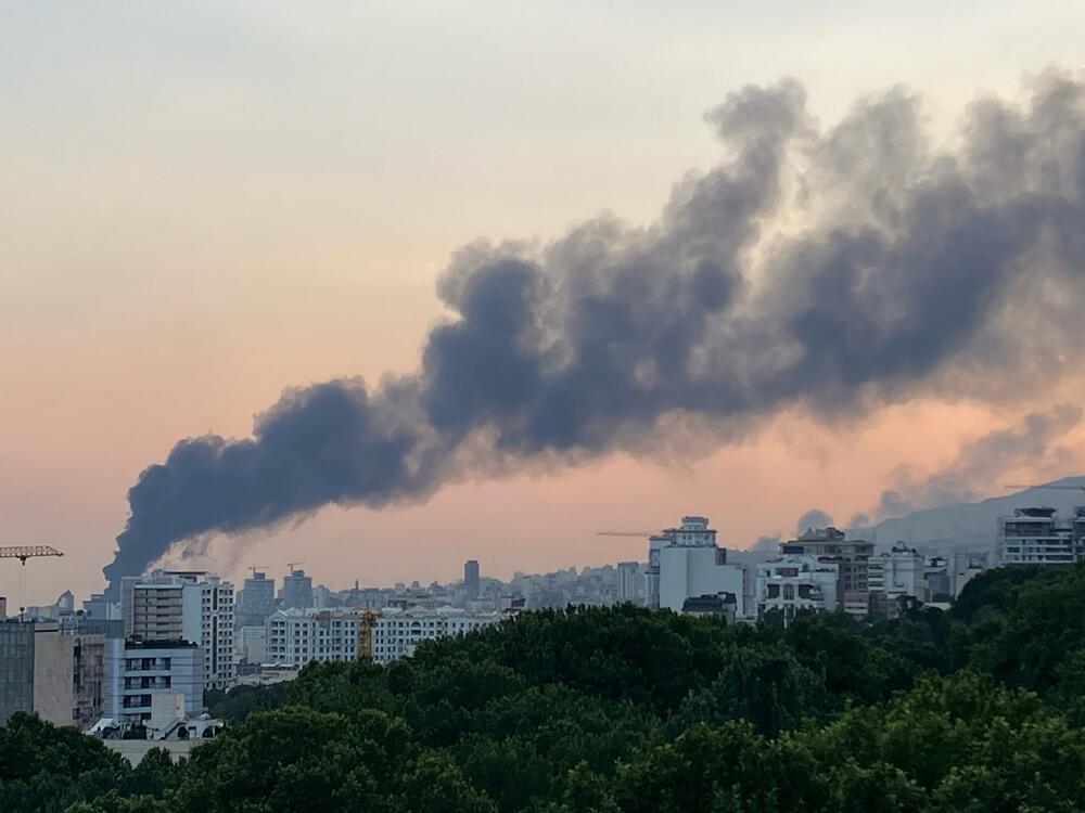 Smoke billows from an explosion at the Islamic Republic of Iran Broadcasting (IRIB) building in Tehran after an Israeli strike hit the building, cutting off live coverage, on June 16.