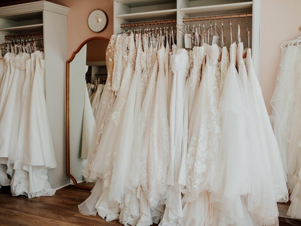 Urban Set Bride co-owner Christine Greenberg says tariffs affect not only gowns, but many other imports needed at her Virginia store: veils, hairpieces, garment bags, hangers and even paper for the check-out register. 
