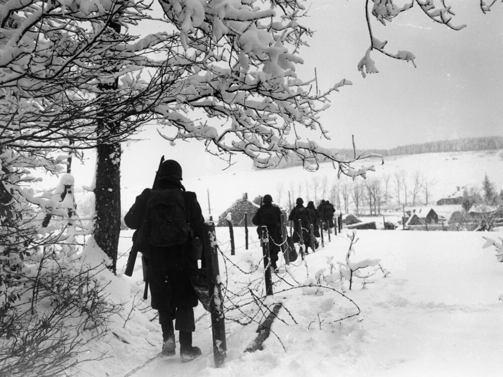 U.S. Army troops march through Belgium on Jan. 25, 1945, during the Battle of the Bulge.