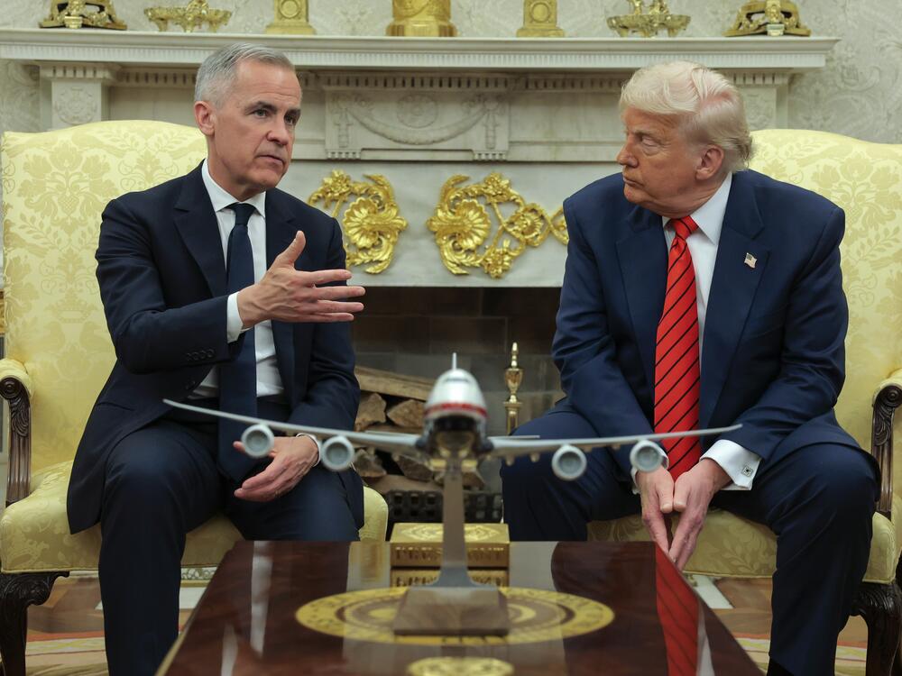 President Trump meets with Canadian Prime Minister Mark Carney in the Oval Office at the White House in Washington, D.C., on May 6, 2025. Carney's government said on Sunday it would scrap a tax on U.S. tech companies after Trump threatened higher tariffs on Canadian goods.
