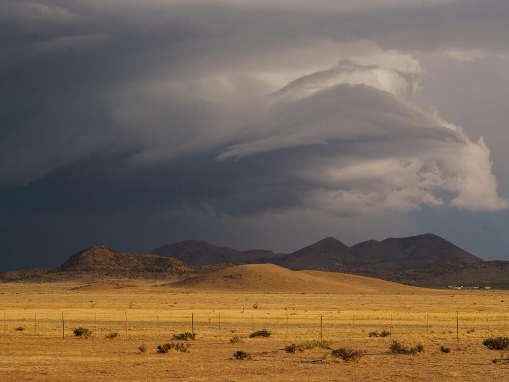 A storm cloud rolls in over the hills near McDonald Observatory.