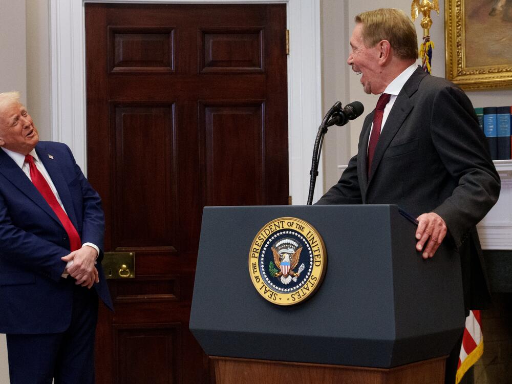 Oracle co-founder, CTO and Executive Chairman Larry Ellison and President Trump share a laugh as Ellison uses a stool to stand on as he speaks during a news conference about artificial intelligence investments in the White House on January 21, 2025.