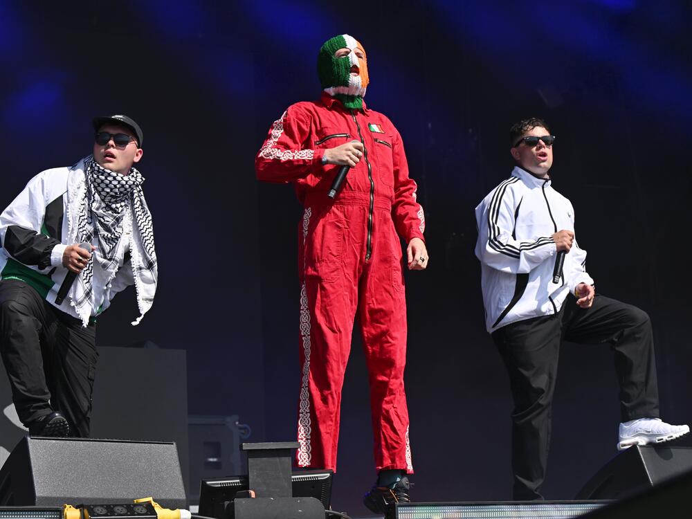 Mo Chara, DJ Próvaí and Móglaí Bap of Kneecap during day four of Glastonbury festival.
