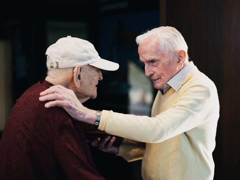 Andrew Roth (left) stands up from his wheelchair to give Jack Moran a hug at the Shoah Foundation at the University of Southern California in Los Angeles. Roth was imprisoned in the Buchenwald concentration camp, which Moran helped liberate while serving in the U.S. Army.<br><br><br><br>