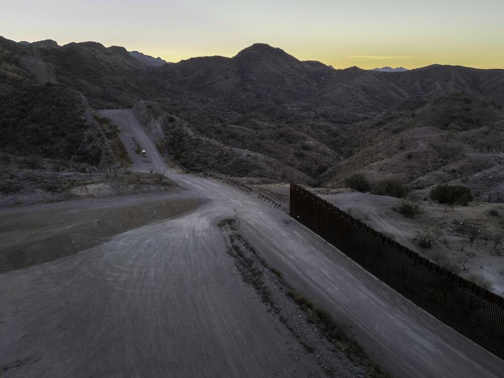 From an aerial view, the U.S.-Mexico border fence ends with a gap on Jan. 20, 2025 near Sasabe, Ariz. Republicans' tax and spending bill includes $46.5 billion for border wall projects.