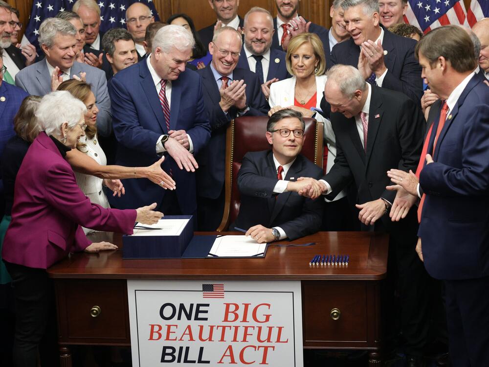 House Speaker Mike Johnson, R-La., celebrates with fellow House Republicans during an enrollment ceremony following final passage on Thursday.