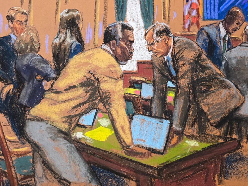Sean Combs and his attorney Marc Agnifilo discuss with other defense lawyers on how to respond to a new note sent by jurors, during Combs' sex trafficking trial in New York City on Tuesday in this courtroom sketch.