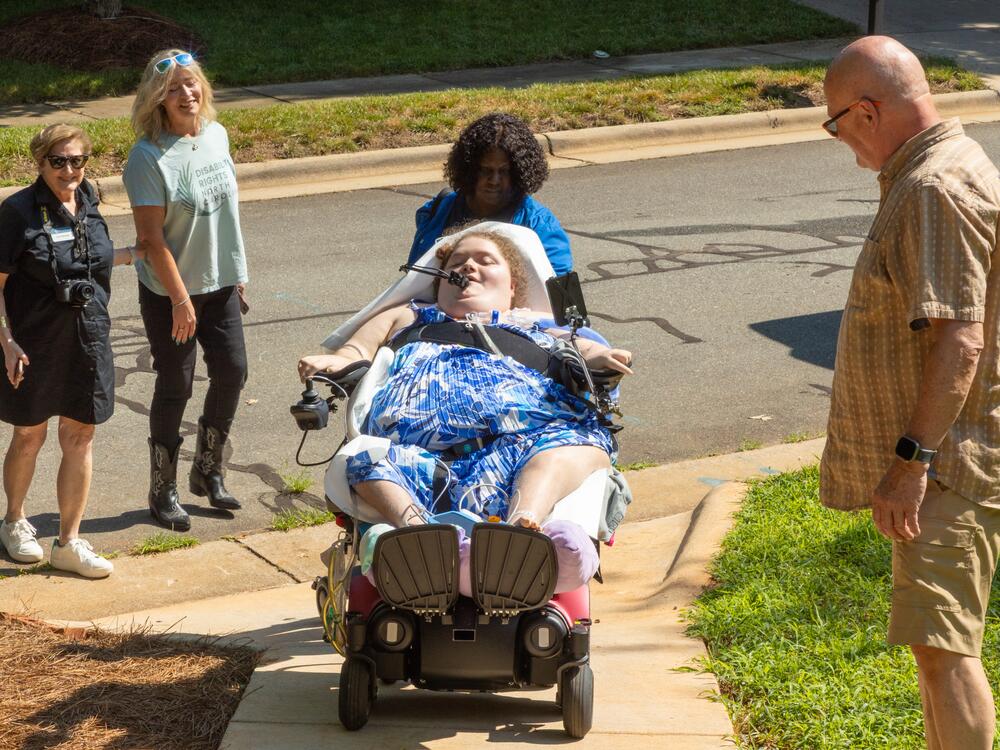 Ratcliff is assisted by a nurse and joined by Cas Shearin (left) and Kirby Morrow of Disability Rights North Carolina and Matt Graham, her live-in caregiver.