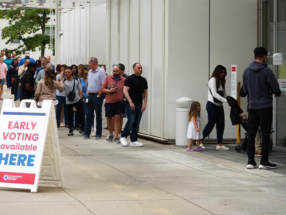 In this file photo, voters head into a polling location to cast their ballots on the last day of early voting for the 2024 election on Nov. 1, 2024 in Atlanta. A new federal report shows early in-person voting increased from 2020 to 2024.
