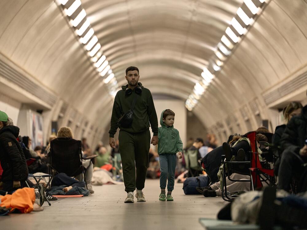 Local residents take cover in the metro station used as shelter during a mass drone and missile attack by the Russian Federation on the capital on Kyiv.
