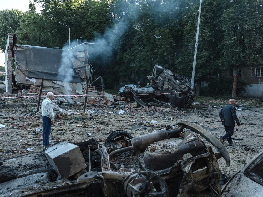 Residents inspect the damage following a Russian air strike in a residential area of Kyiv, Ukraine.