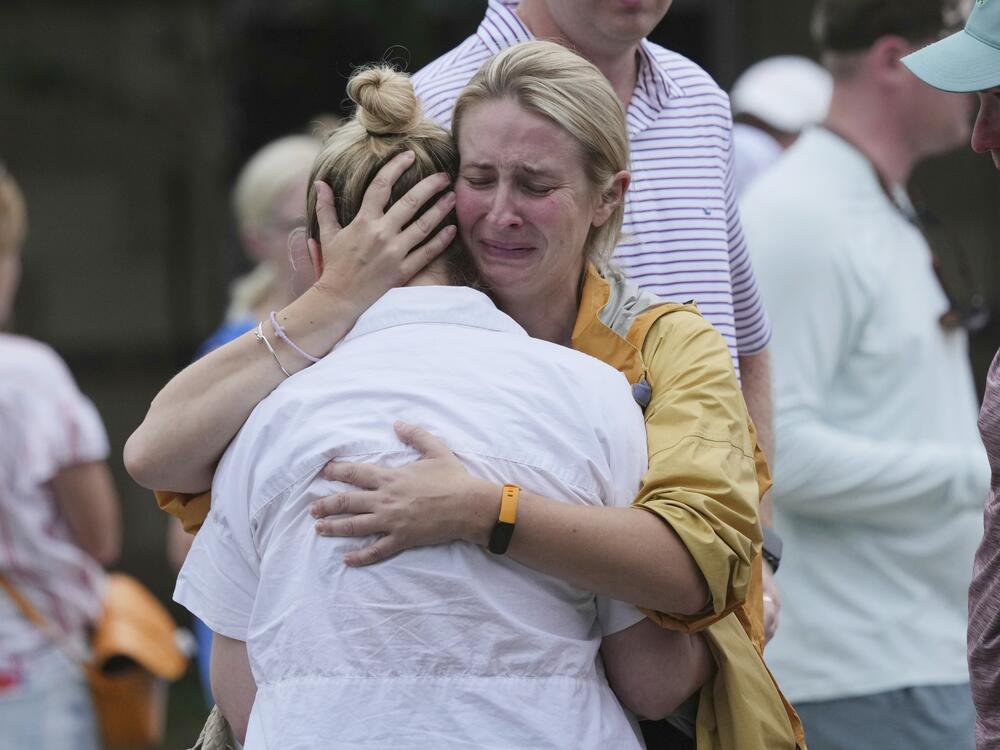 Families are reunited at a reunification center after flash flooding hit the area  in Ingram, Texas