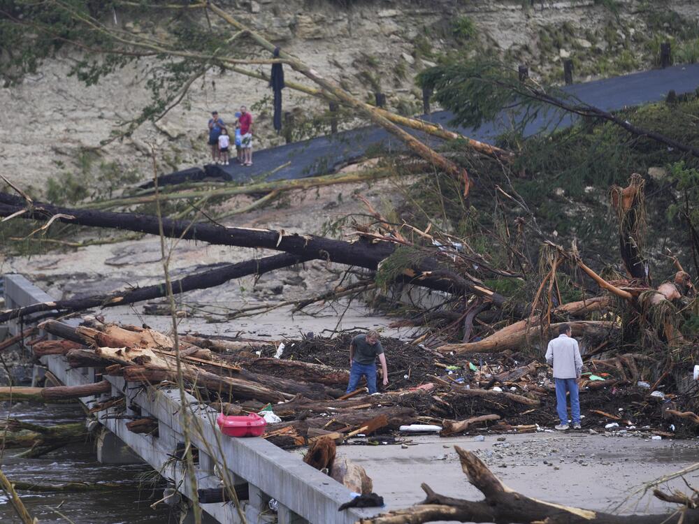 Debris rests on a bridge over the Guadalupe River after a flash flood swept through the area in Ingram, Texas.