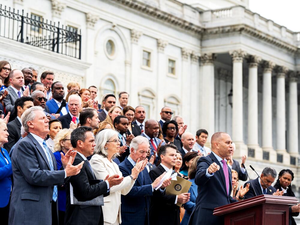 House Minority Leader Hakeem Jeffries, D-N.Y., along with the House Democratic Caucus, assemble on the Capitol steps to rail against President Trump's signature bill of tax breaks and spending cuts on July 2.