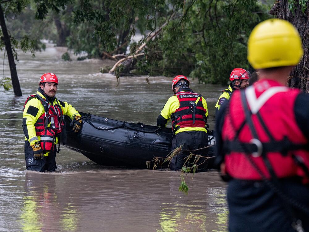Boerne search and rescue team members prepare their Zodiac boat for operations on the flooded Guadalupe River on July 4, 2025 in Comfort, Texas.