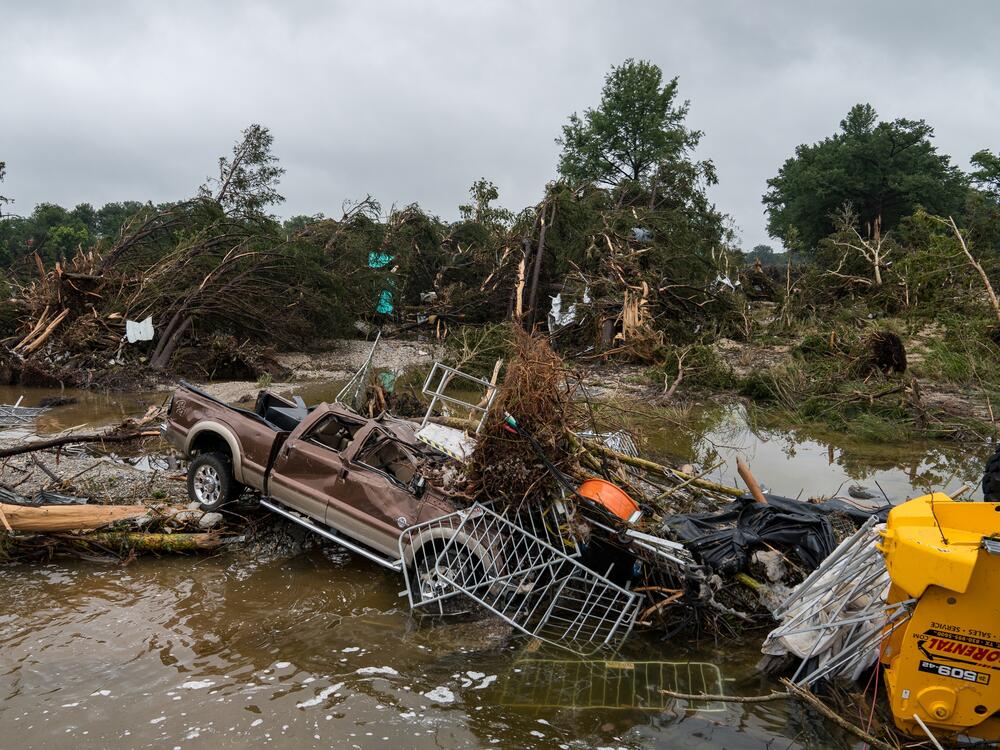 Flood waters left debris including vehicles and equipment scattered in Louise Hays Park in Kerrville, Texas.