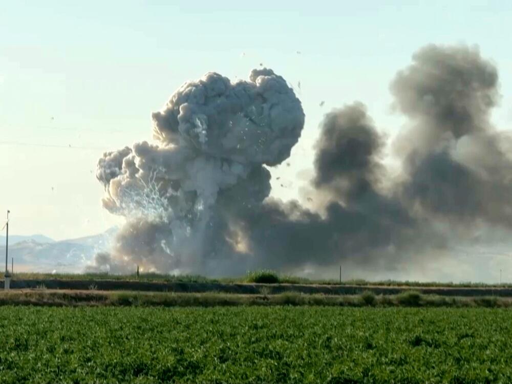 In this image taken from video, smoke and flames rise from a fireworks warehouse explosion on  July 1 in Esparto, Calif.