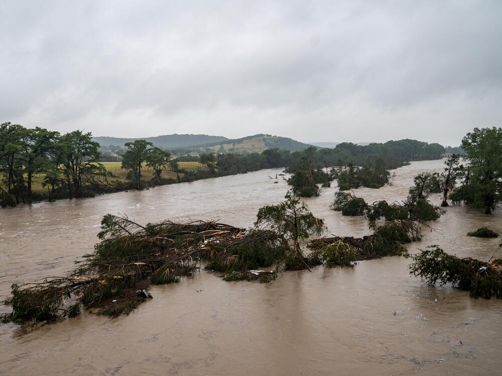Trees emerge from flood waters along the Guadalupe River on Friday in Kerrville, Texas. Heavy rainfall caused flooding along the Guadalupe River in central Texas with multiple fatalities reported.