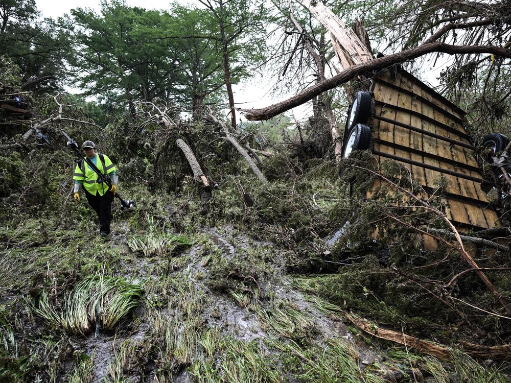 A volunteer looks for missing people, following severe flash flooding that occured during the July 4 holiday weekend, in Hunt, Texas, on July 6, 2025.