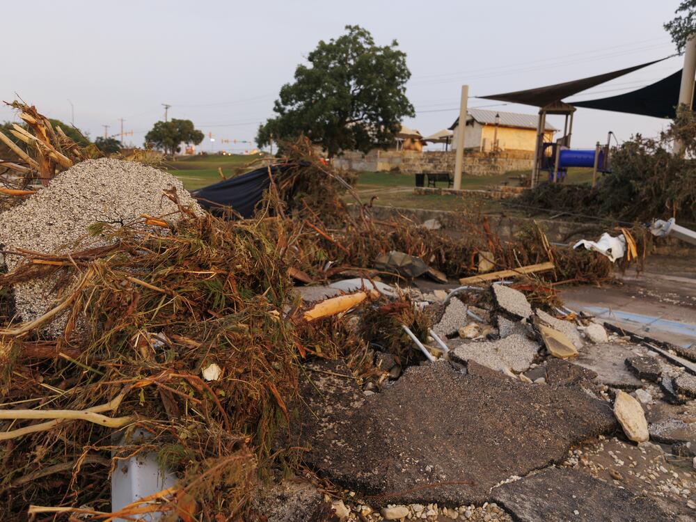 Debris is seen in the Guadalupe River in Kerrville, Texas, on Sunday.