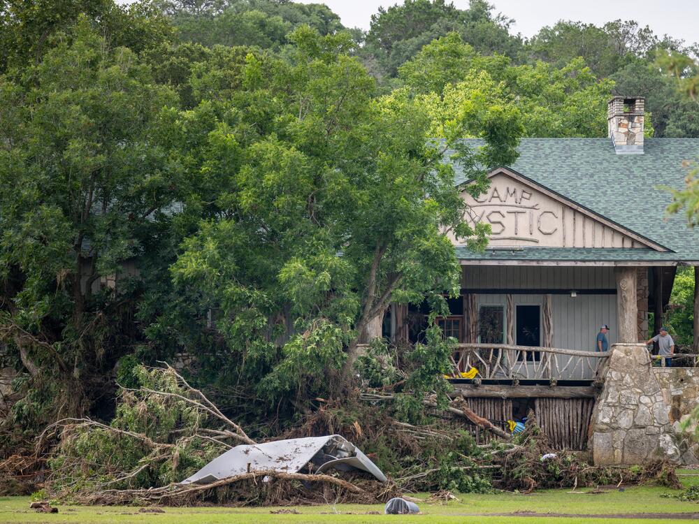 Debris is piled up at the entrance to Camp Mystic on Monday in Hunt, Texas. Heavy rainfall caused severe flash flooding along the Guadalupe River in central Texas, leaving at least 85 people reported dead.