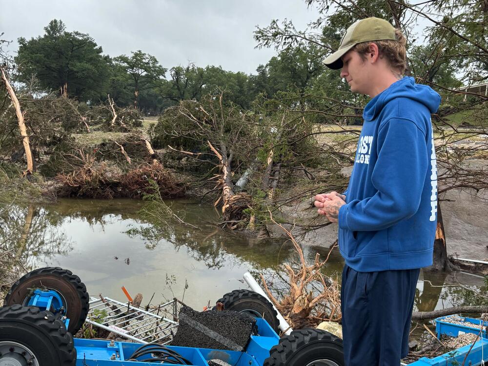 Ryan Dale observes the destruction at the Louis Hays Park in Kerrville, Texas on July 5, 2025.