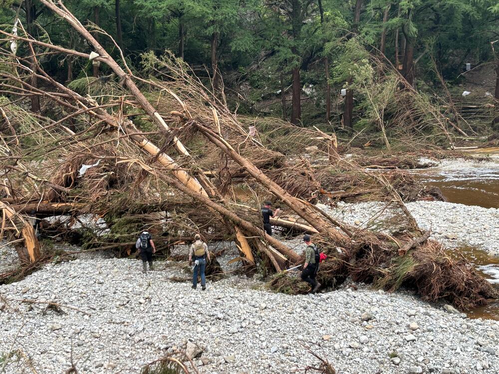 First responders search for missing people near Camp Mystic, an all-girls summer camp along the Guadalupe River in Kerrville, Texas, on Saturday.