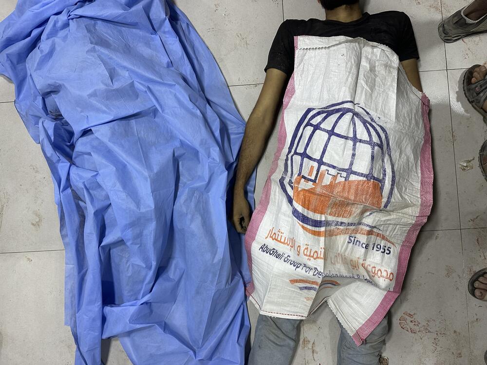 At the Al-Awda Hospital in northern Gaza, the bodies of Palestinians killed while seeking to access a Gaza Humanitarian Foundation food site were covered by the same empty food sacks they had brought with them in the hopes of filling them with food, on June 24, 2025.