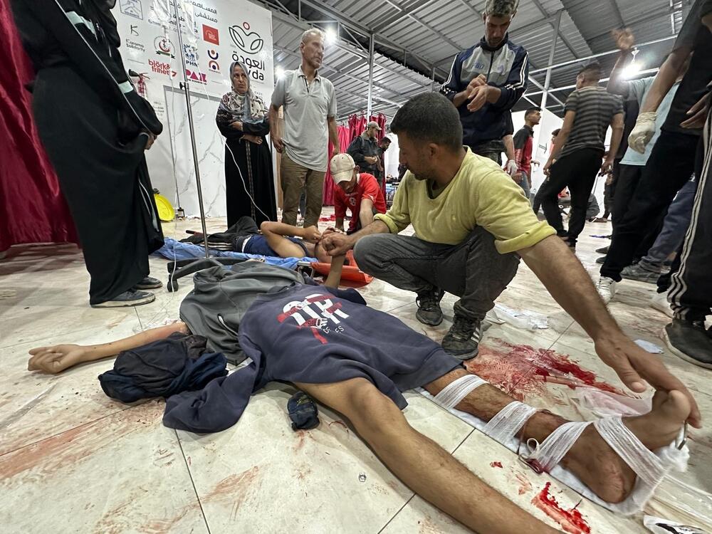Palestinians wounded by Israeli military fire as they walked toward a Gaza Humanitarian Foundation food distribution center are treated at the Al-Awda Hospital in northern Gaza on June 24, 2025.