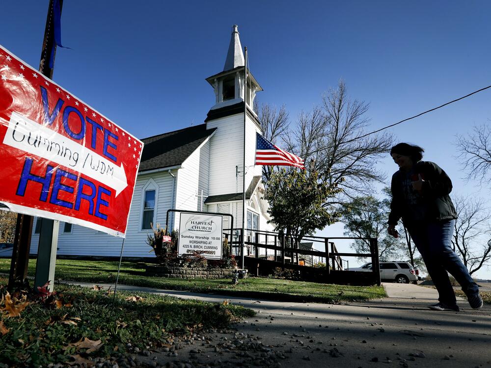 A local resident leaves a church after voting in an election in Cumming, Iowa.