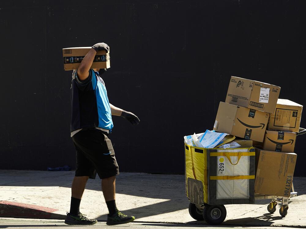 An Amazon worker delivers packages in Los Angeles.