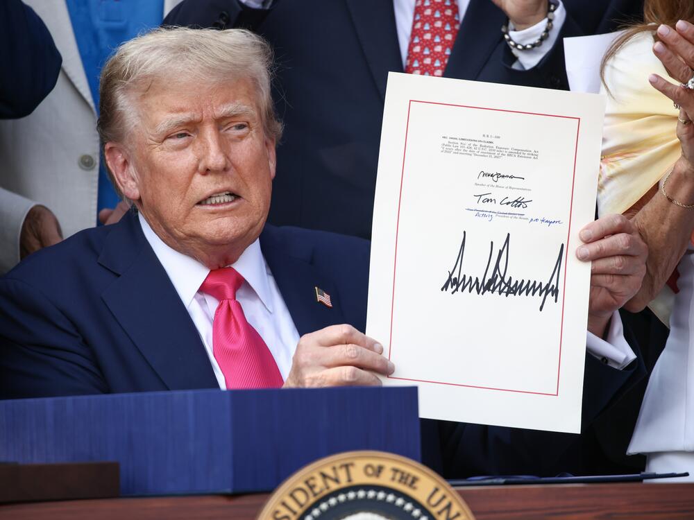 President Trump, joined by Republican lawmakers, signs the 