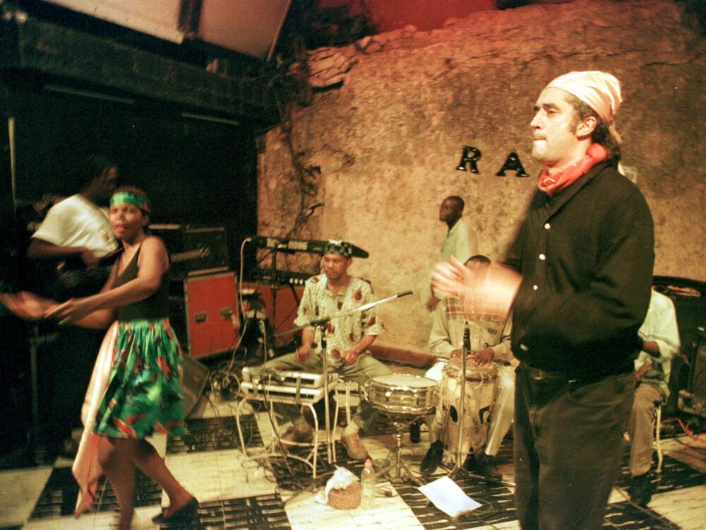 Richard Morse, right, sings with his group, Ram, at the famous Hotel Oloffson on Port-au-Prince, Haiti, Jan. 20, 2000.  Morse, the son of an American scholar and a Haitian dancer who grew up in Woodbridge, Connecticut, is the latest in the Oloffson's long line of operators.