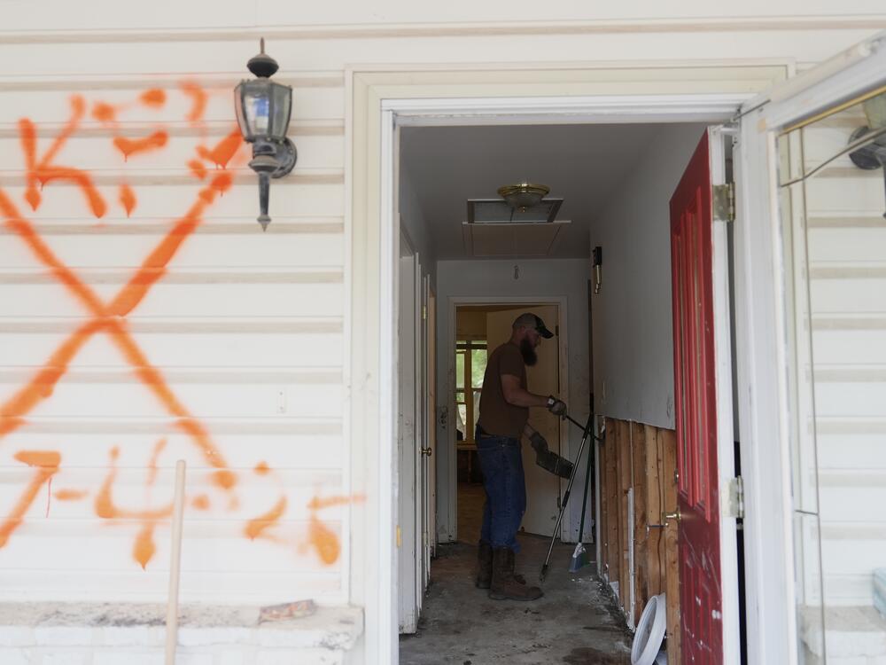 Volunteers clean up a house after flooding in Kerrville, Texas. The state's governor and top emergency official are on a board considering options to eliminate the Federal Emergency Management Agency, at the request of President Trump.