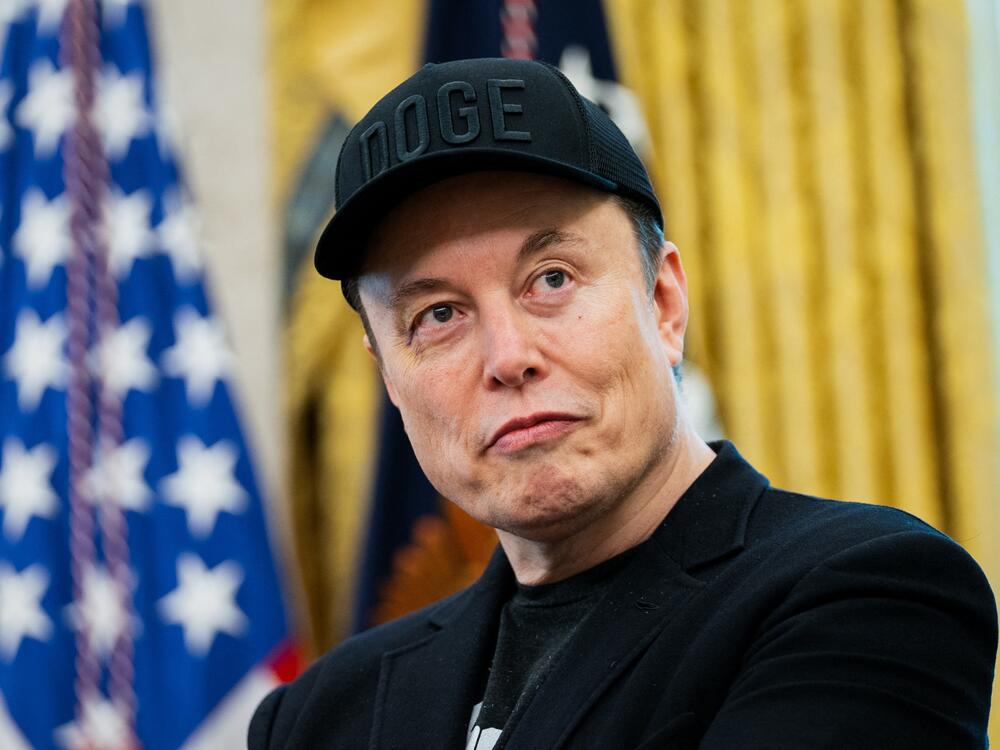 Elon Musk looks on during a news conference with President Trump in the Oval Office on May 30.