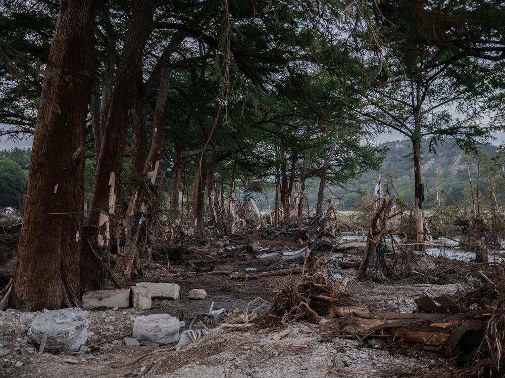 Debris lays along the Guadalupe River on Tuesday after it was swept up in the flash flooding in Ingram, Texas. More than 100 fatalities were reported after heavy rainfall caused flooding along the river in central Texas.