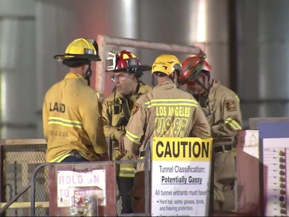 This image taken from footage provided by KABC/ABC7 Los Angeles shows first responders working the scene after a tunnel collapsed on Wednesday, July 9, 2025, in Los Angeles.