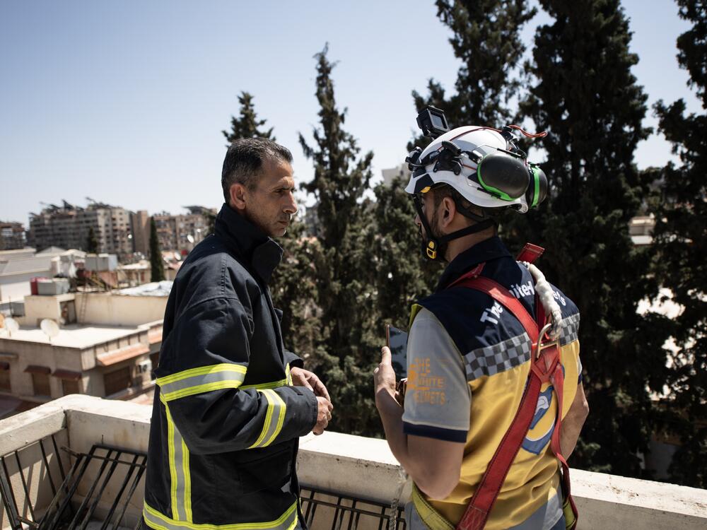 Firefighter Naser Brjas and White Helmet member Kinan Ali respond to an emergency call in Damascus on March 31, 2025.