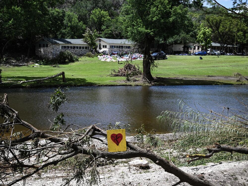 A painted broken heart is seen near Camp Mystic along the Guadalupe River in Hunt, Texas, on July 8, 2025, after severe flash flooding over the July 4 holiday weekend.