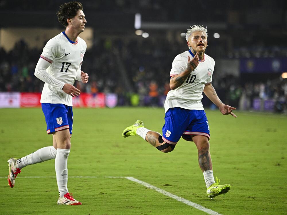 USA midfielder Diego Luna (#10), with a broken nose after taking an elbow to the face, celebrates a goal with USA's midfielder Brian Gutierrez during a match against Costa Rica on Jan. 22. This was only Luna's third game with the U.S. national team, and his first-ever start. He wasn't going to give up that opportunity so easily, he said later.