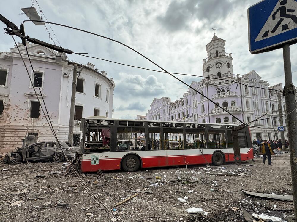 Emergency crews work at the site of a Russian missile attack in the center of Sumy this April.