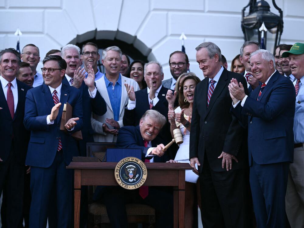 President Trump bangs a gavel after signing the One Big Beautiful Bill Act at the White House on July 4.