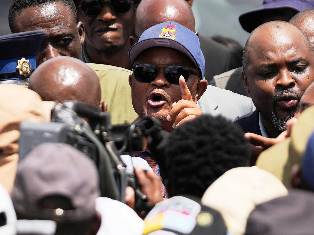 FILE - South Africa's Police Minister Senzo Mchunu, center, visits an abandoned gold mine where miners are rescued from below ground, in Stilfontein, South Africa, Jan. 14, 2025.