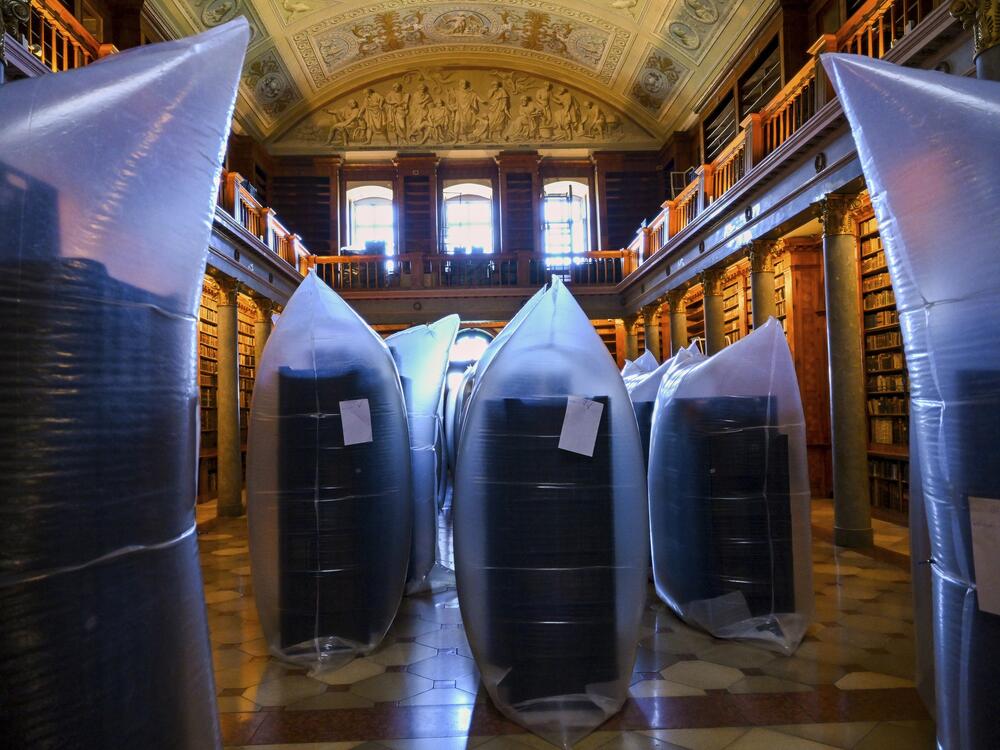 This photo provided by Pannonhalma Archabbey shows books kept in hermetically sealed plastic sacks for disinfection at the Pannonhalma Archabbey's library in Pannonhalma, Hungary on July 3 as a beetle infestation threatens its ancient collection.