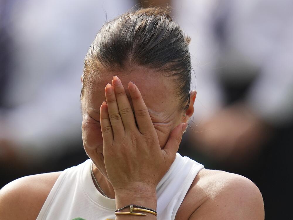 Amanda Anisimova of the U.S. reacts after losing the women's singles final match against Iga Swiatek of Poland at the Wimbledon Tennis Championships in London, Saturday, July 12, 2025.